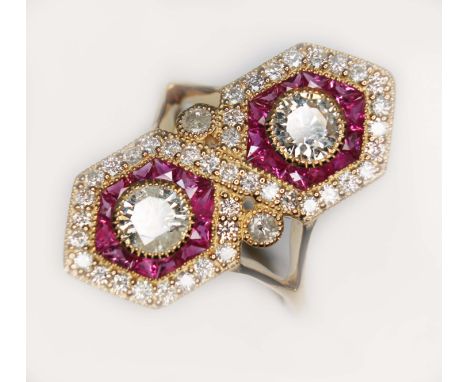 An Art Deco style diamond and ruby cluster ring, the cluster measuring approx. 24.52mm x 10.56mm, two millegrain set round br