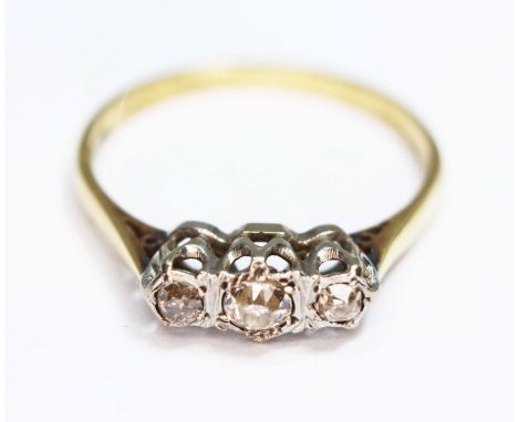 A three stone diamond ring, the stones weighing approx. 0.05, 0.10 and 0.05 carats, hallmarked 18ct gold band, gross wt. 2.50