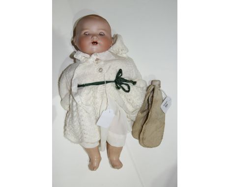 A GERMAN ARMAND MARSEILLE bisque headed doll, impressed 351/4.K to the back of the head, complete with composite body, 40cm h