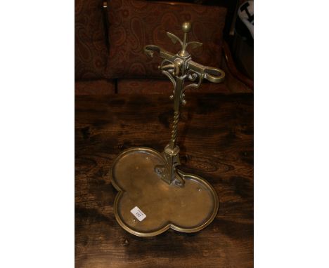 A BRASS STICK STAND with triform base