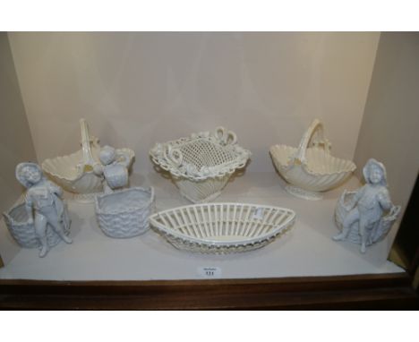 A CREAMWARE OPEN BASKET, a pair of Royal Worcester white fluted baskets, three late 19th Century German white glazed figures 