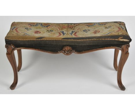 A VICTORIAN ROSEWOOD STOOL with tapestry top on carved cabriole legs, 48cm high, 100cm wide