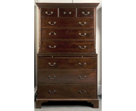 A GEORGE III MAHOGANY TALL BOY of two parts, the top section having three short and three long drawers over the bottom sectio