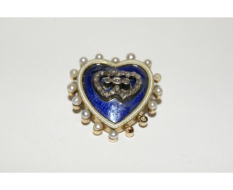 A 14K GOLD BROOCH of heart shaped form with yellow and white enamel decoration with diamond chip and seed pearl settings
