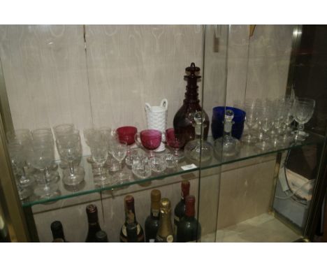 A SMALL COLLECTION OF GLASSWARE to include a ruby glass decanter, three blue glass finger bowls, two Waterford glasses and ot