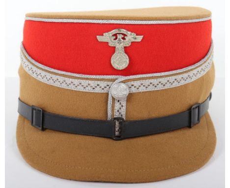 Third Reich NSKK Leaders Kepi, light tan wool kepi with red centre. Aluminium wire piping to the crown and bordering the cent