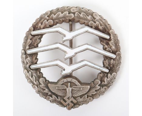 Third Reich NSFK Award Badge, white metal and enamel breast badge with pin and catch fixing to the reverse. Maker marked and 