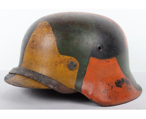 German Army Combat Helmet with WW1 Pattern Camouflage, being a M-42 pattern helmet shell which has a bright WW1 patchwork pat