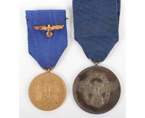 German Armed Forces 12 Year Long Service Medal, with gilt eagle to the blue ribbon. Accompanied by a Third Reich Police 8 yea