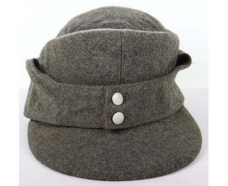 German Army Officers M-43 Cap, field grey / green wool body with two pebbled button front. Officers silver wire piping to the