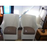 A pair of painted loom-weave armchairs, together w