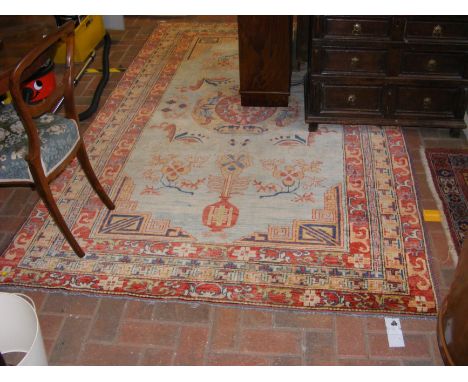 A Middle Eastern carpet with geometric border - 270cm x 170cm