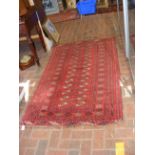 A Middle Eastern rug with red ground - 170cm x 105