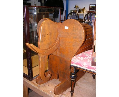 A child's vintage wooden rocking elephant 