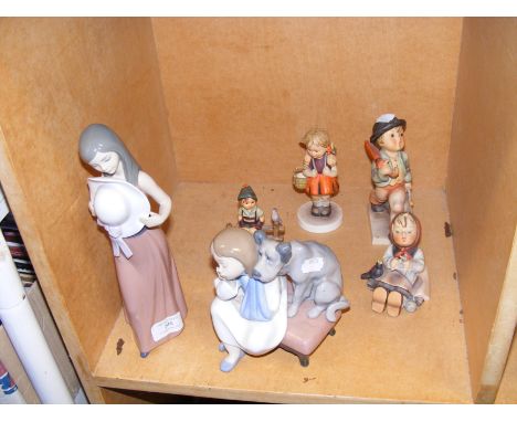 A Lladro ornament of girl and dog on footstool, a Lladro lady and four Hummel figures 