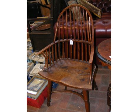 An early stick back country armchair with elm seat and crinoline stretcher  CONDITION REPORT In our judgement, condition of l