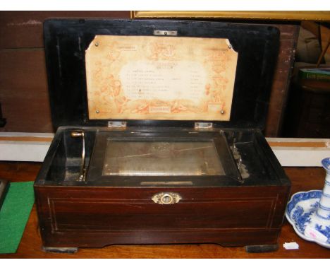A Victorian cylinder music box playing eight airs - 36cm wide  CONDITION REPORT In our judgement, condition of lot is fair an