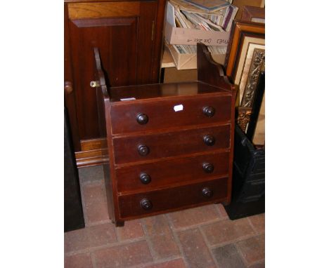 A four drawer hanging wall cabinet 