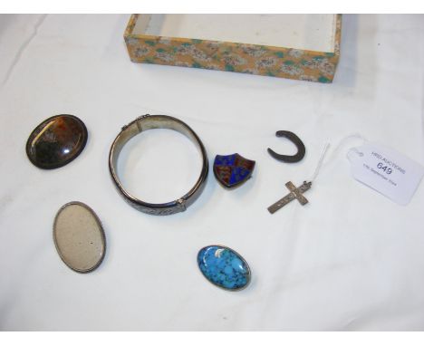 A sterling silver bangle, together with silver pendants and brooches 