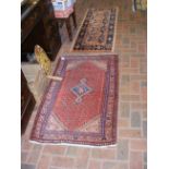 A small Middle Eastern style runner and one other