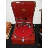 A vintage HMV portable wind up gramophone in red hard case