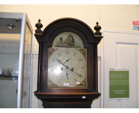 An oak longcase clock with striking movement and painted arched dial by Cogger, Newport 
