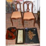 A pair of bedroom chairs together with serving tra