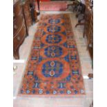 A Middle Eastern runner with centre medallion and