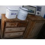 An antique pine cupboard together with a chest of