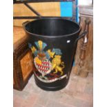 A hand painted two handled metal bin