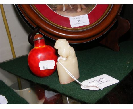 A 6cm high carved jade seal, together with an oriental snuff bottle  CONDITION REPORT In our judgement, condition of lot is g