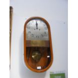 A 1930's wall clock - 65cm, bearing plaque