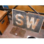 A vintage cast metal 'SW' (Sound Whistle) sign - 7