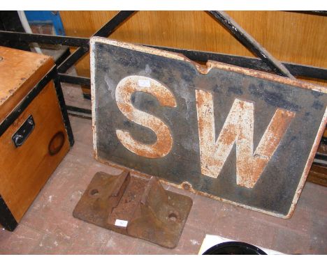 A vintage cast metal 'SW' (Sound Whistle) sign - 72cm x 50cm, together with a vintage GWR rail track chair 