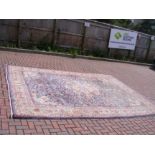 A large Middle Eastern style carpet with geometric