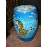 A 46cm high ceramic garden seat with painted decor