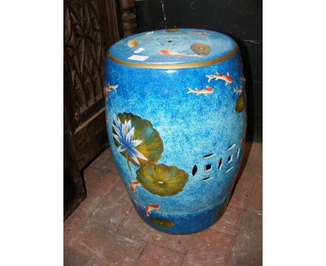 A 46cm high ceramic garden seat with painted decoration