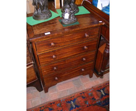 An inlaid mahogany chest of four drawers on bracket feet 