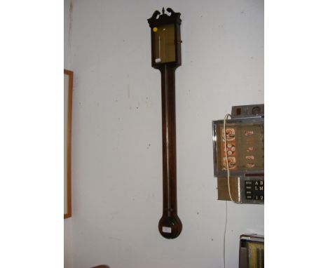 A modern wall barometer/thermometer