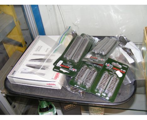 A quantity of Marklin and other gauge unopened track packages, points, curves, etc. 