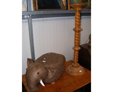 An elephant style footstool, together with a light wood plantstand 