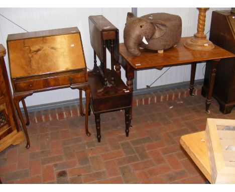 A walnut veneered bureau, a Pembroke table on castors, an antique Sutherland table and a commode (without porcelain liner) 