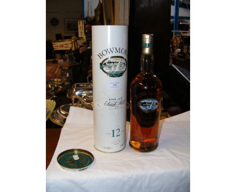 A bottle of Bowmore 12 Year Old Scotch Whisky - in presentation sleeve 