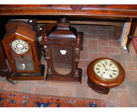 A wooden cased striking mantel clock, mahogany cased wall clock and a mantel clock case only 