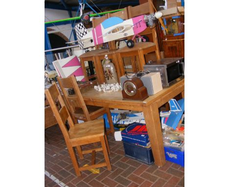 An extending light oak dining table with eight chairs - the unextended length is approx. 180cm 