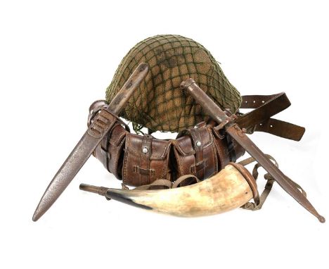 BRITISH MK V-TYPE HELMET, CIRCA 1983 with canvas cover and netting, interior stamped marks, cloth chinstrap, along with a lea