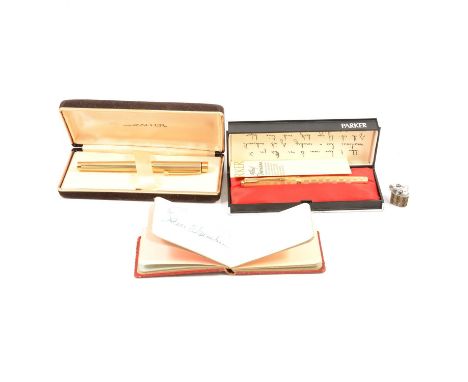 A Parker 65 Cumulus fountain pen, 14K nib, with instructions, in original box; a Schaeffer gold-plated fountain pen, 14K nib,