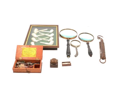 German silver mounted magnifying glass, lens chipped, 19cm, two other larger brass and ebonised magnifying glasses, eight cla