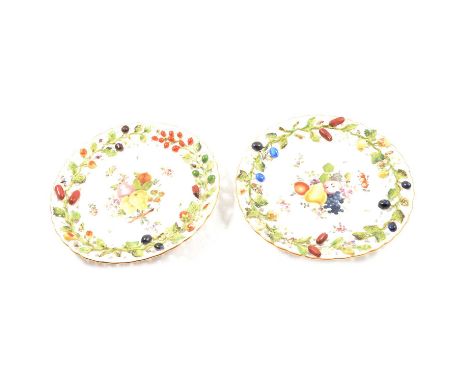 Pair of Dresden dessert plates, encrusted, pierced with fruit, and painted with fruit, diameter 23cm.Condition report:Please 