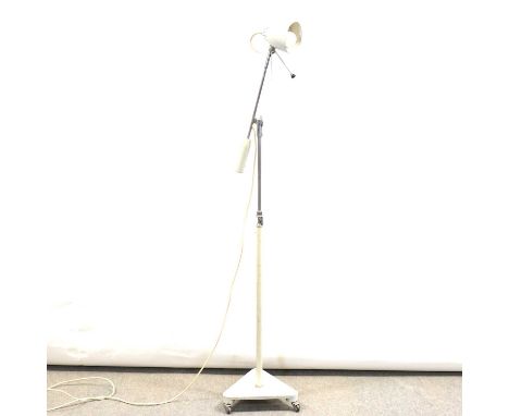 Industrial style standard lamp, adjustable arm and column, triangular base.